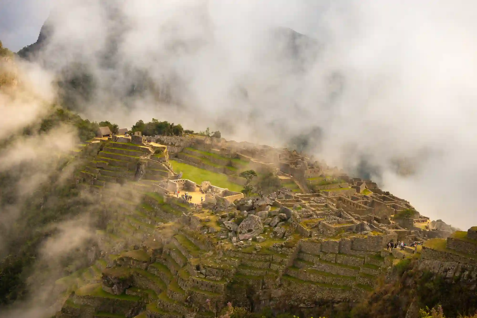 machu-picchu-illuminated-by-first-sunlight-coming-out-from-opening-clouds